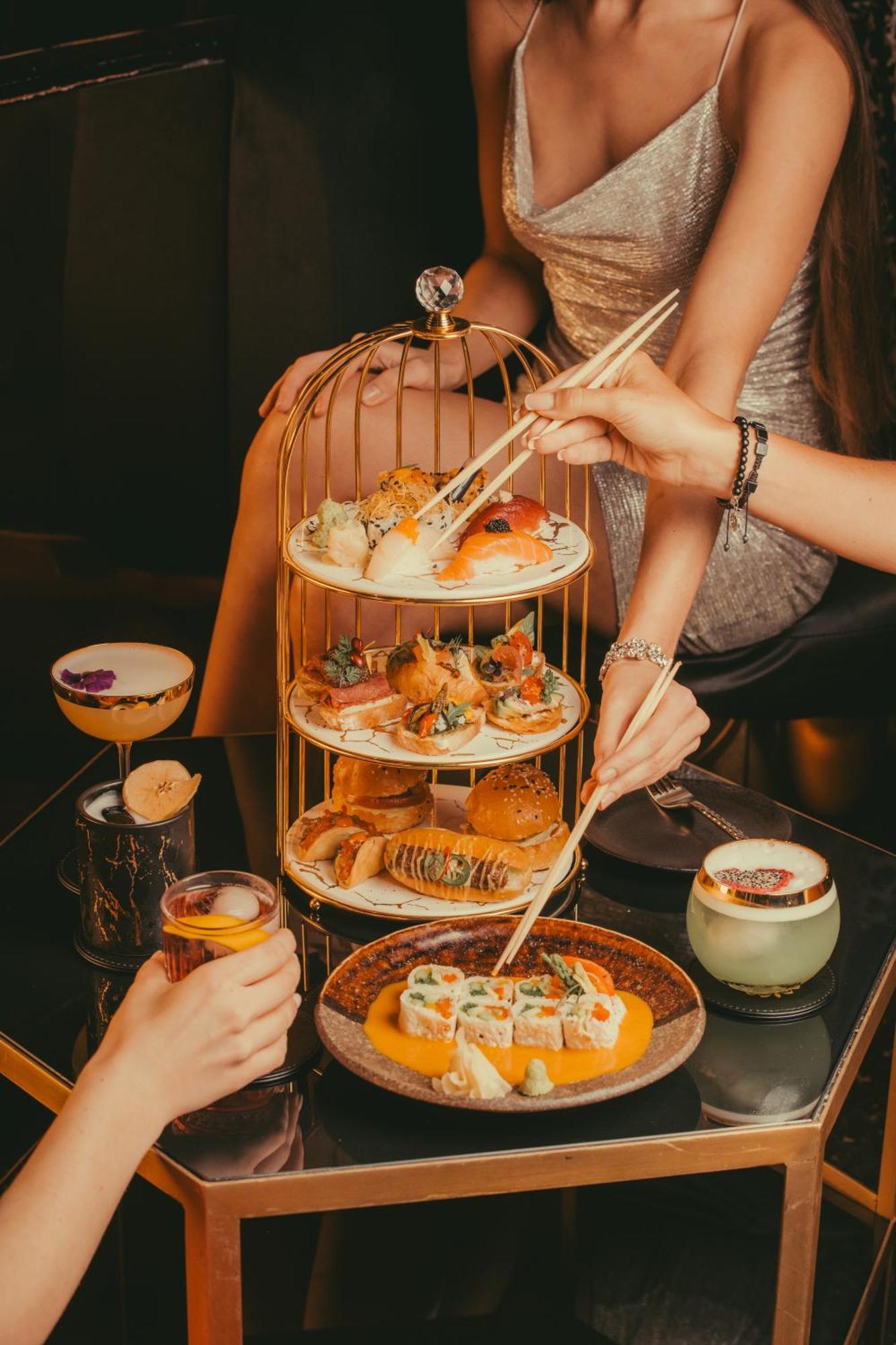Five Jumeirah Village Dubai Exterior foto Afternoon tea at the Mandarin Oriental
