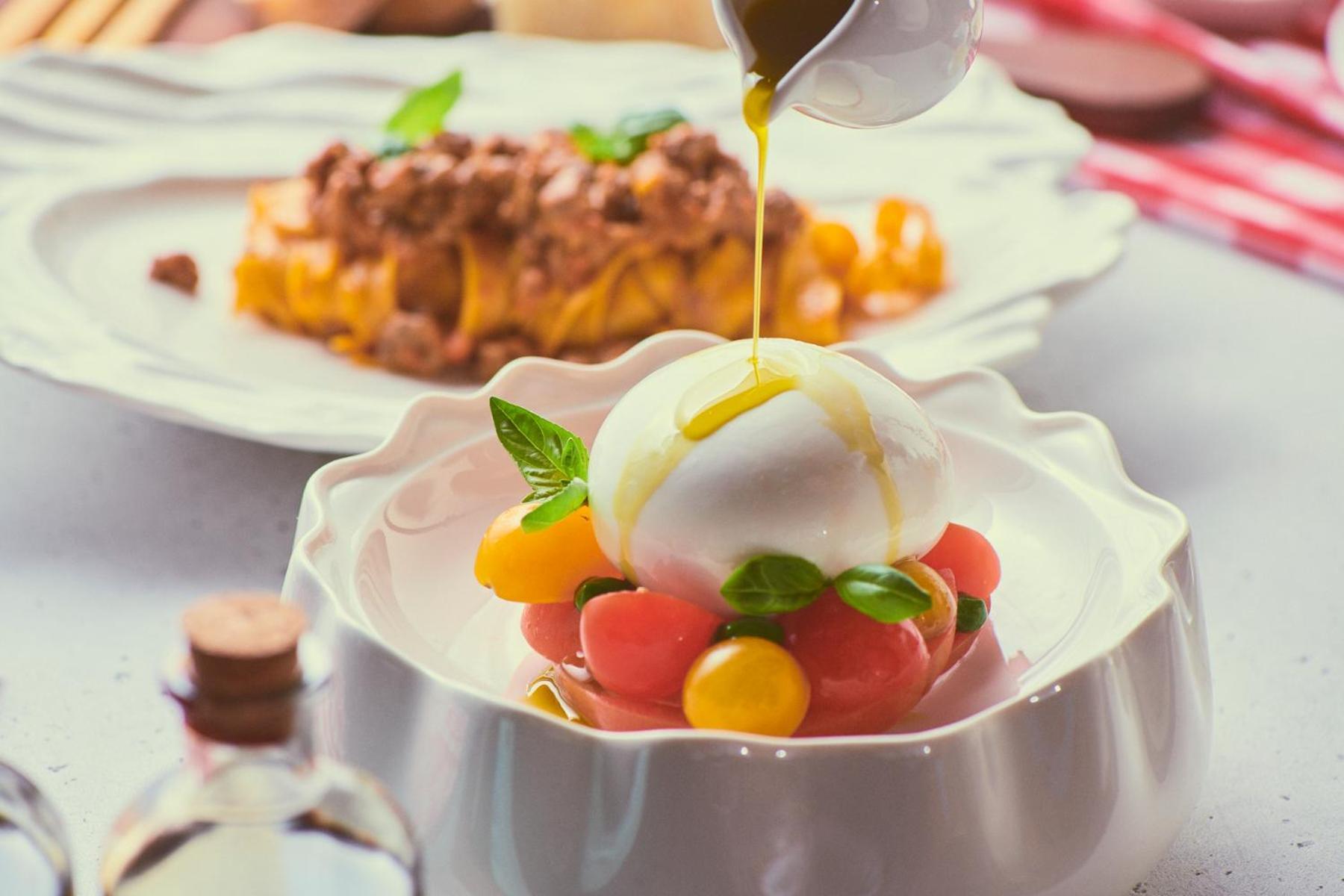 Five Jumeirah Village Dubai Exterior foto A salad being drizzled with olive oil